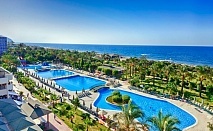  На ПЪРВА ЛИНИЯ в MC ARANCIA RESORT HOTEL 5*, Алания, Турция. Чартърен полет от София + 7 нощувки на човек на база Ultra All Inclusive + басейни и водни пързалки! 