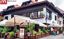  Почивка в центъра на Банско! Нощувка на човек със закуска в хотел и механа Момини двори 