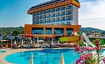  Почивка в хотел Throne Beach Resort & Spa 5*, Сиде, Турция! Автобусен транспорт + 7 нощувки на база All Inclusive на човек + басейни. Дете до 11.99г. безплатно! 