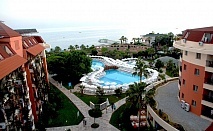  Почивка в Palmeras Beach Hotel 5*, Алания, Анталия! Транспорт от Варна или Бургас + 7 нощувки на човек на база Ultra Аll Inclusive + басейни и водни пързалки. 