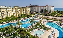  Ultra All Inclusive почивка на 50м. от плажа в Алания, Турция! Автобусен транспорт + 7 нощувки на човек в хотел HEDEF RESORT & SPA 5*  + басейни и водни пързалки. Дете до 11.99г. безплатно 